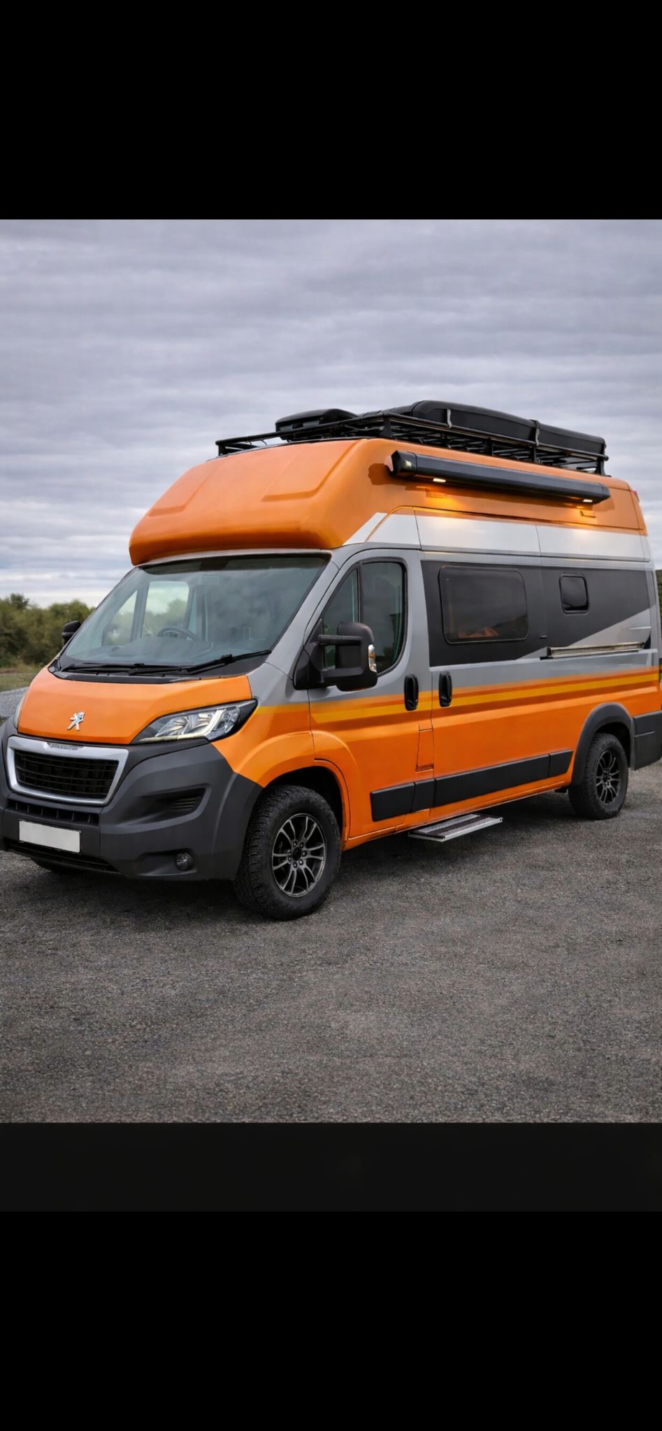 Orange campervan conversion with GRP high-top